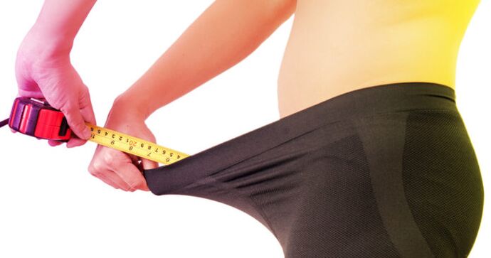 Man measures penis before enlargement